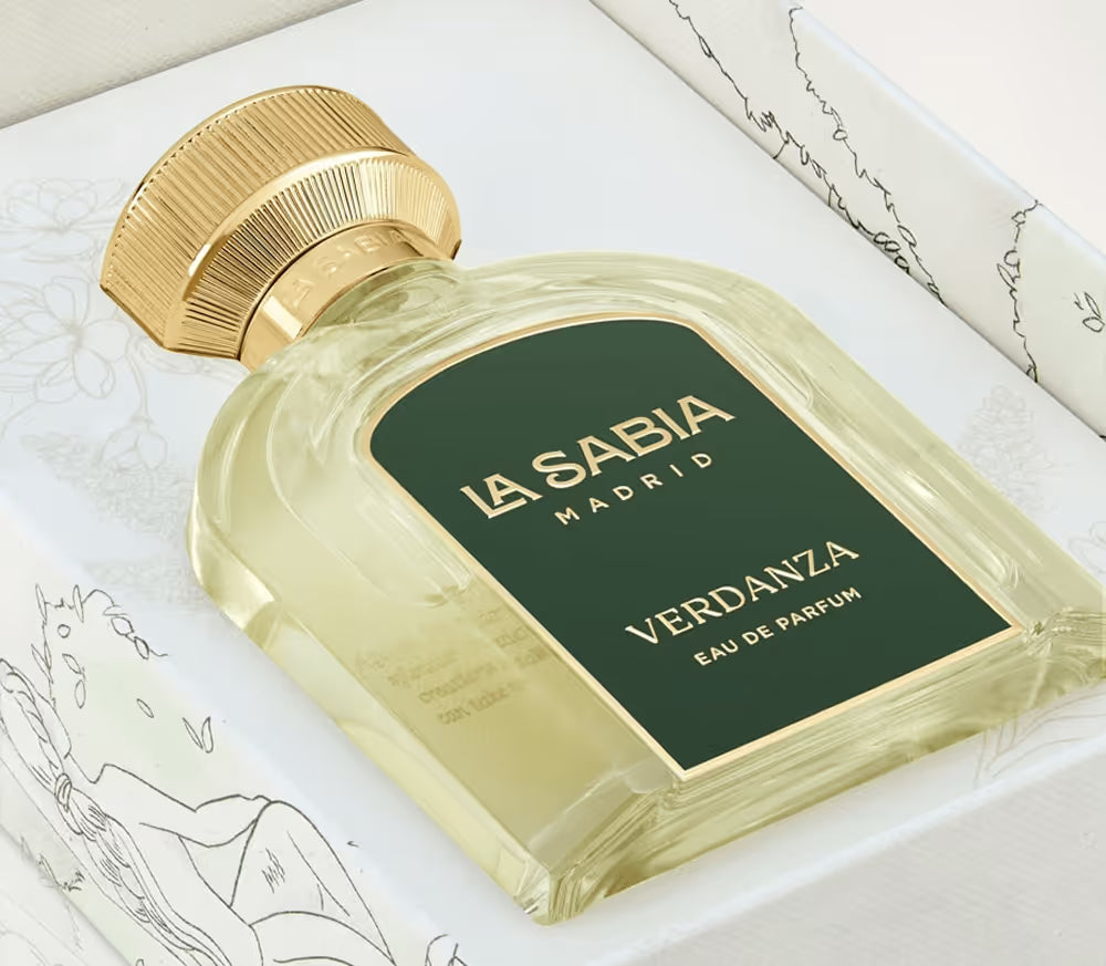 Perfume bottle labeled 'La Sabia Madrid Verdanza' on a white surface with gold cap.
