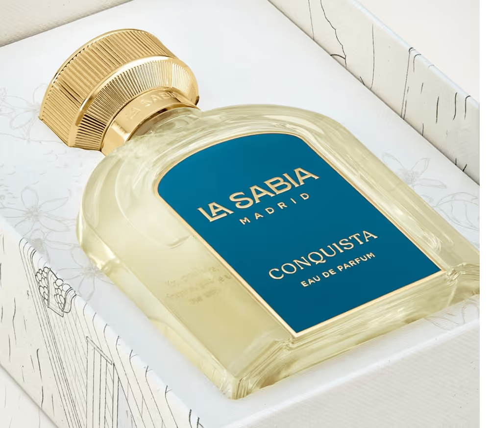 Perfume bottle labeled 'La Sabia Madrid Conquista' with gold cap on a white background